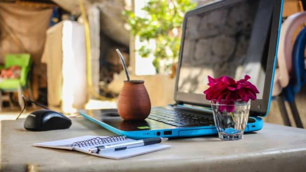 white-notebook-beside-blue-laptop-computer-1212818-remote-work-Millennials